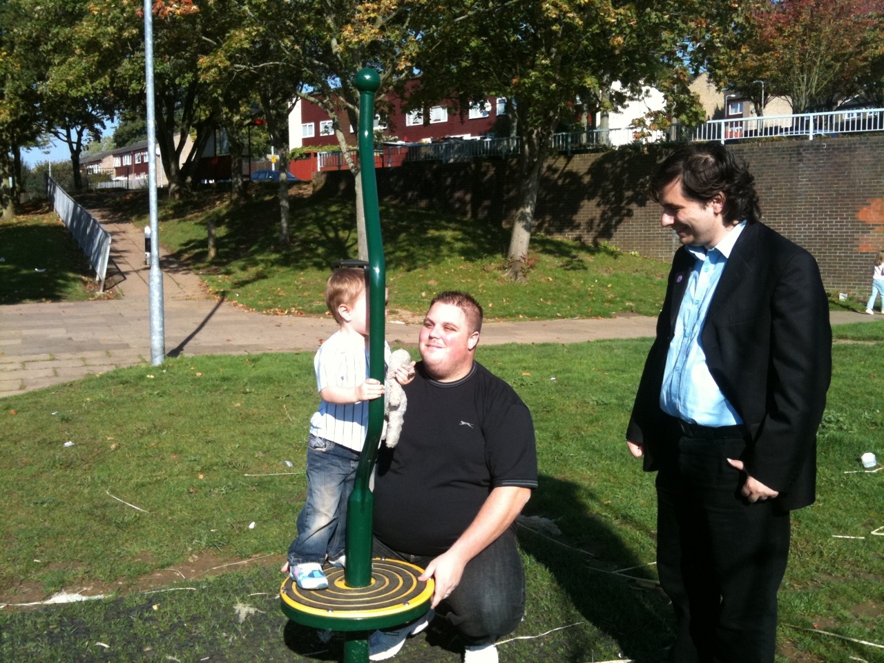 Mike Fuller & Cllr Richard Giddings at the new play area wirh Mike’s son (Jamie, aged 2).